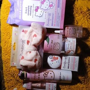 (8)THE CREME SHOP HELLO KITTY MASK, TONER, CREAM, SERUM, LIP OIL BALM WIPES BAND